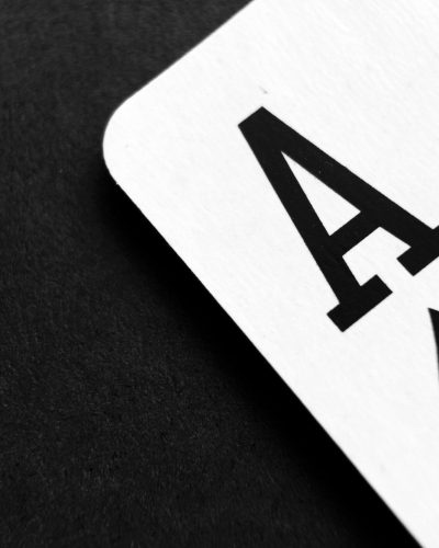 Ace of Spade Playing Card on Grey Surface